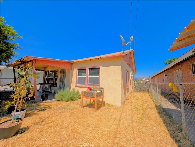 back of property featuring a patio