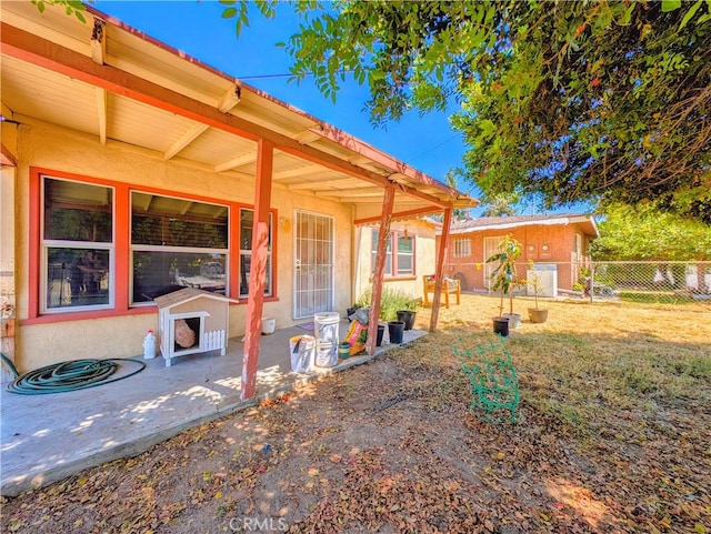 view of front facade with a patio area and a front lawn