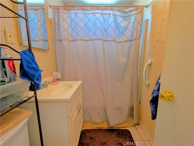 bathroom featuring vanity, toilet, and curtained shower