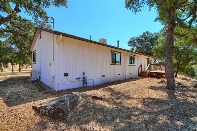 rear view of house featuring a deck