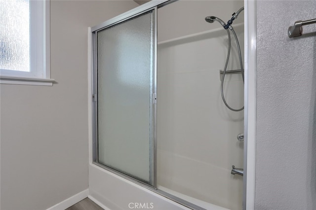 bathroom featuring enclosed tub / shower combo