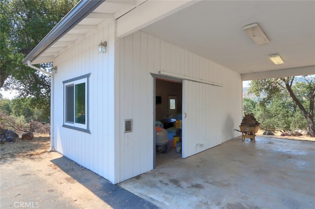 view of property exterior with an outdoor structure