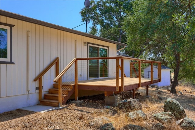 back of house featuring a wooden deck