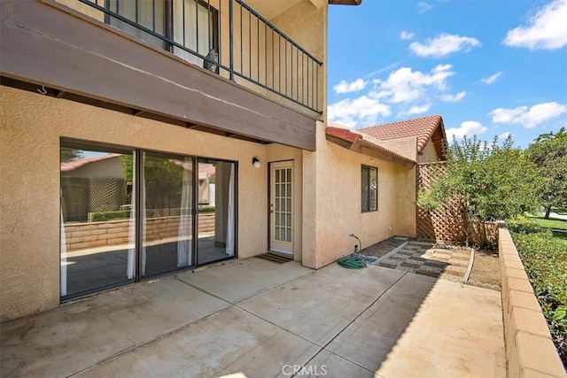 view of patio with a balcony