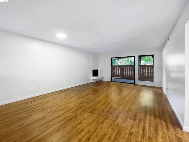 unfurnished living room with light hardwood / wood-style floors