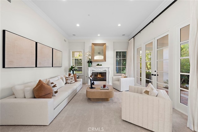 living room with light carpet, crown molding, and french doors