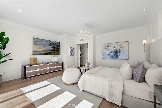 bedroom featuring an inviting chandelier, hardwood / wood-style floors, and ornamental molding