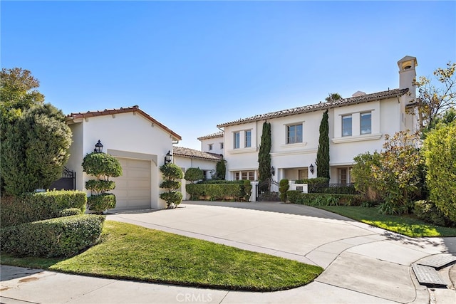 mediterranean / spanish-style home featuring a garage