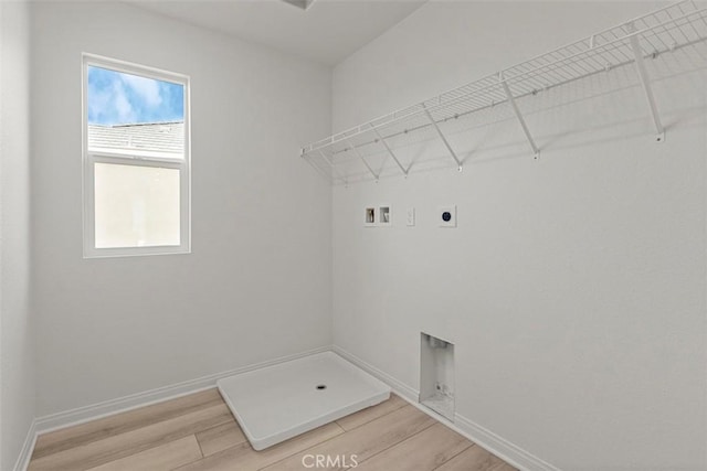 laundry area featuring hookup for a washing machine, wood-type flooring, and hookup for an electric dryer