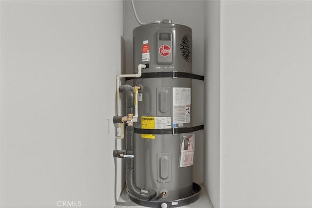 utility room featuring water heater