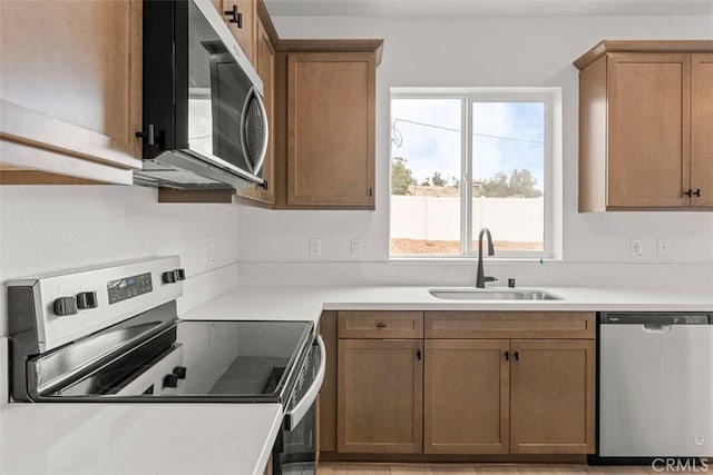 kitchen with appliances with stainless steel finishes and sink