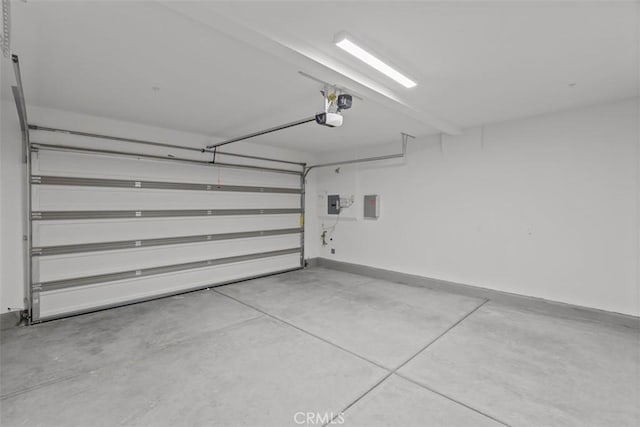 garage featuring a garage door opener and electric panel