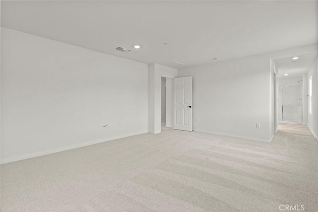 spare room with light colored carpet