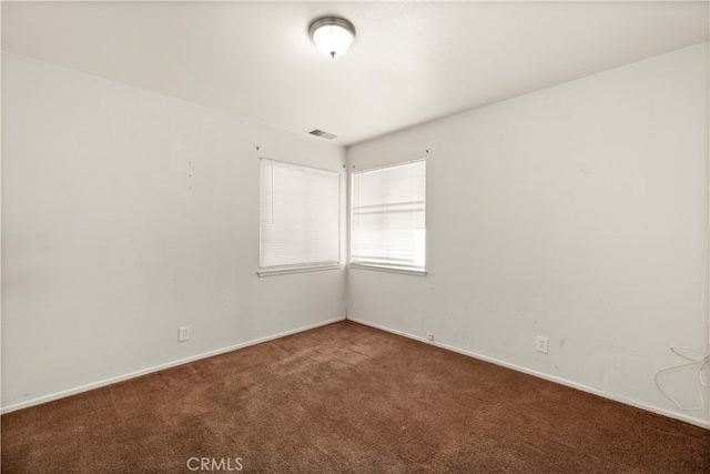 view of carpeted spare room