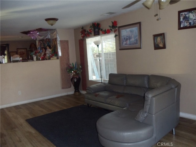 living room with ceiling fan and hardwood / wood-style flooring