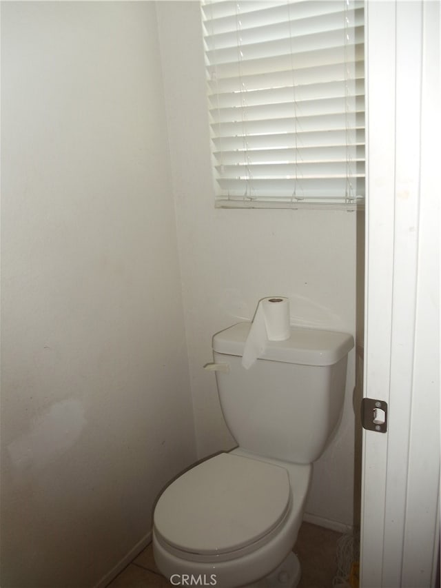 bathroom featuring tile patterned floors and toilet