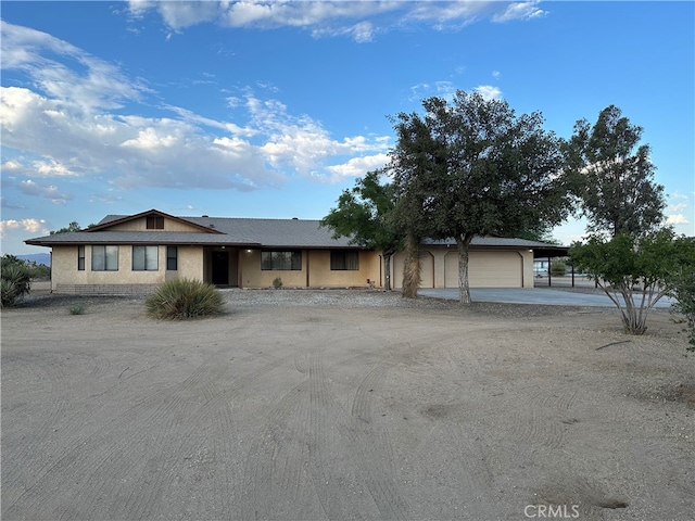 single story home featuring a garage