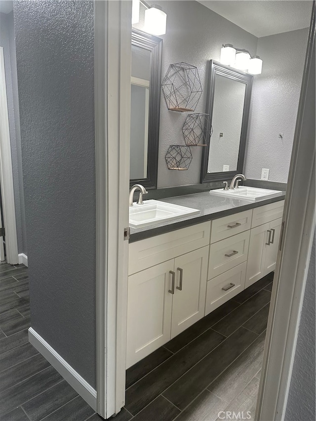 bathroom featuring vanity and hardwood / wood-style flooring