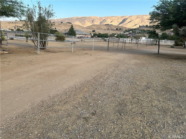 view of road featuring a mountain view and a rural view