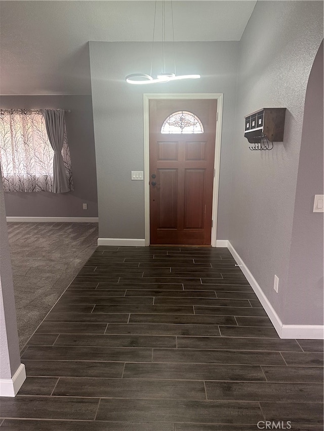 foyer featuring dark wood-type flooring