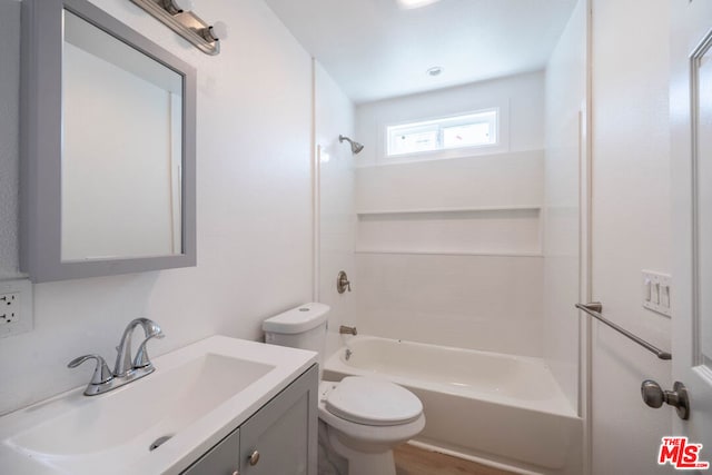 full bathroom with wood-type flooring, vanity, toilet, and shower / washtub combination