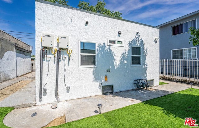 back of property featuring a patio