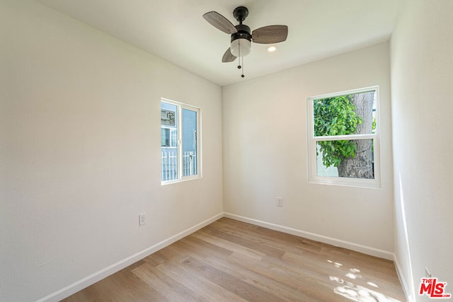 unfurnished room with ceiling fan and light hardwood / wood-style flooring