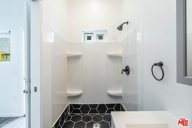 bathroom with walk in shower and vanity