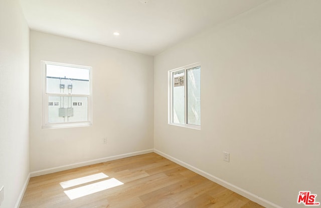 unfurnished room featuring light wood-type flooring