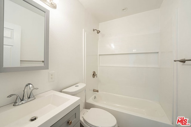 full bathroom with  shower combination, vanity, and toilet