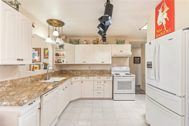 kitchen with light stone countertops, white appliances, sink, white cabinets, and hanging light fixtures