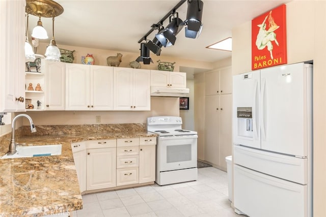 kitchen featuring white cabinets, pendant lighting, white appliances, and sink