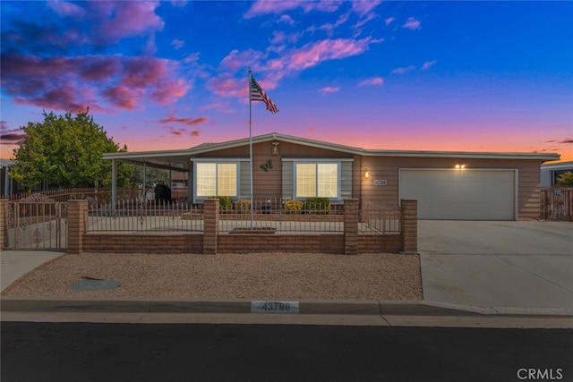 view of front of property featuring a garage and a carport