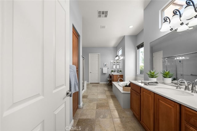 bathroom featuring vanity and separate shower and tub