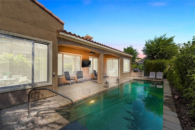 view of swimming pool featuring a patio area