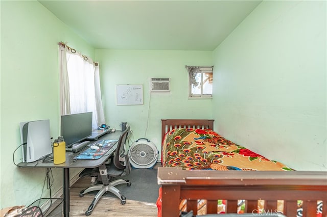 bedroom featuring a wall mounted air conditioner