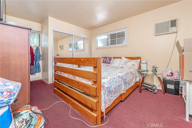 carpeted bedroom with a wall unit AC