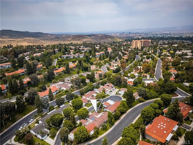 birds eye view of property with a mountain view