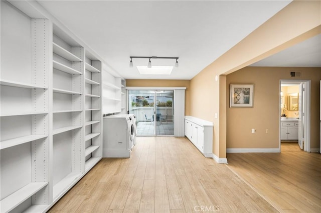 pantry featuring visible vents and independent washer and dryer