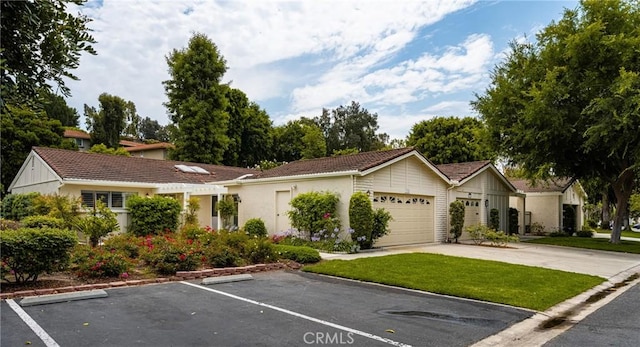 ranch-style house with a garage and uncovered parking