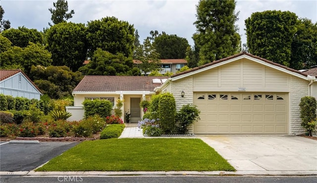 single story home with a garage, concrete driveway, and a front lawn