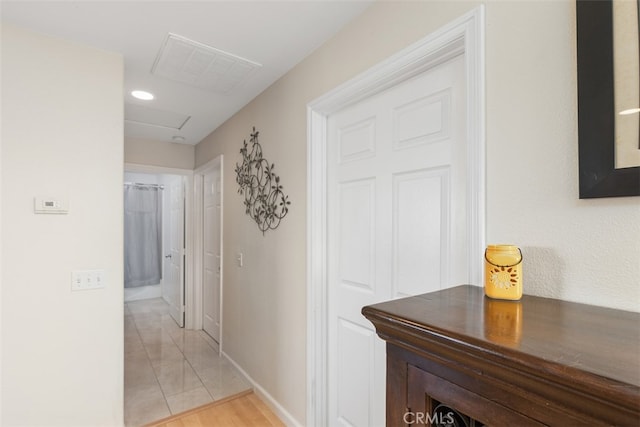 hallway with light tile patterned flooring