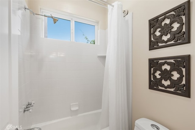 bathroom with toilet and shower / bath combo