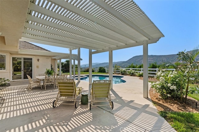 view of patio / terrace featuring a mountain view and a pergola