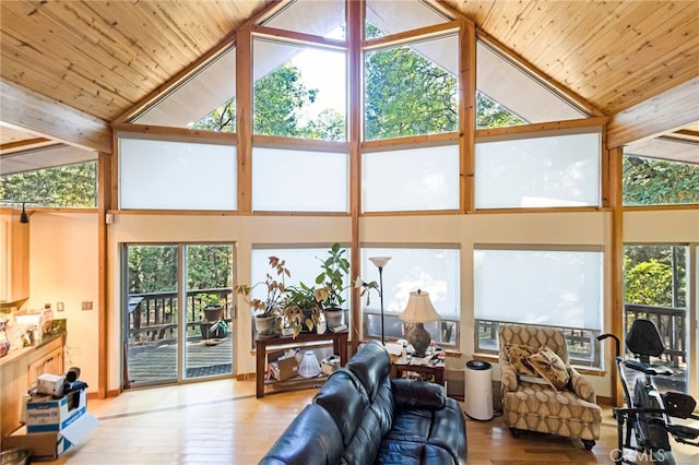 living room with beamed ceiling, high vaulted ceiling, light wood-type flooring, and wooden ceiling