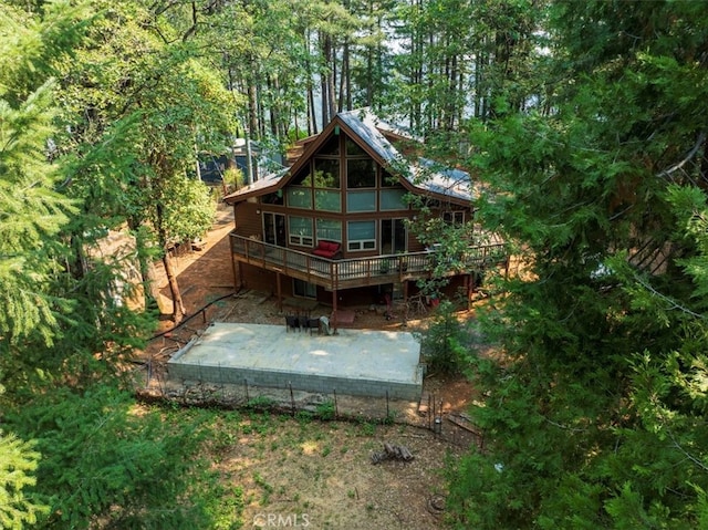 back of house featuring a patio area and a deck