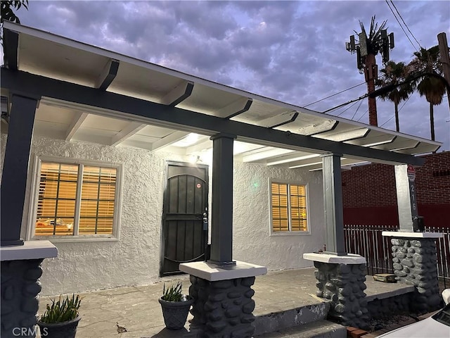 doorway to property featuring a porch