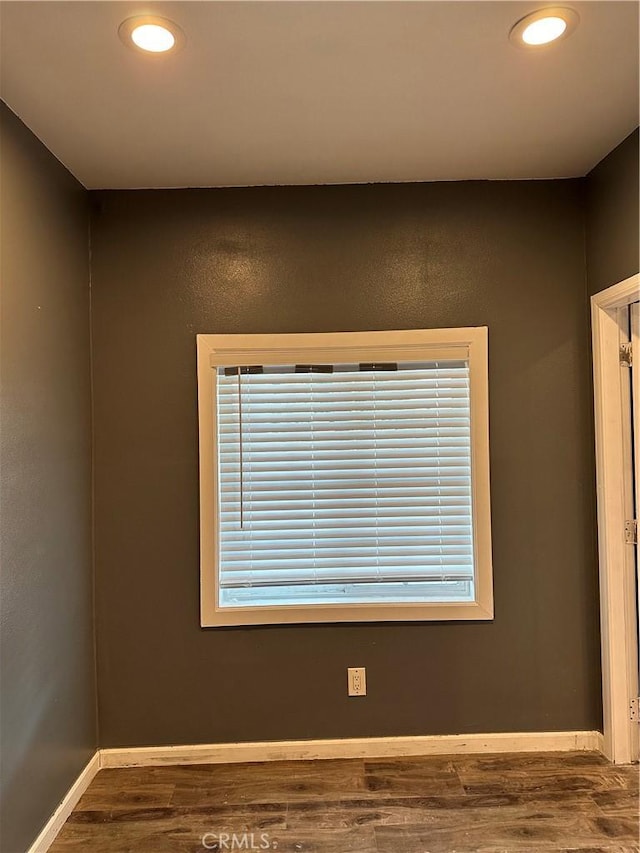 details featuring recessed lighting, baseboards, and wood finished floors