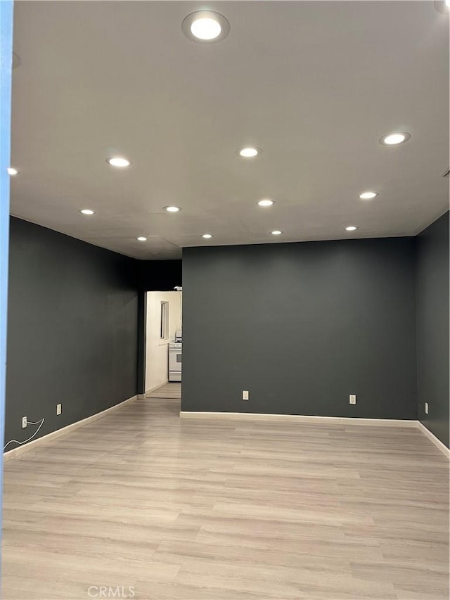 interior space with recessed lighting, light wood finished floors, and baseboards