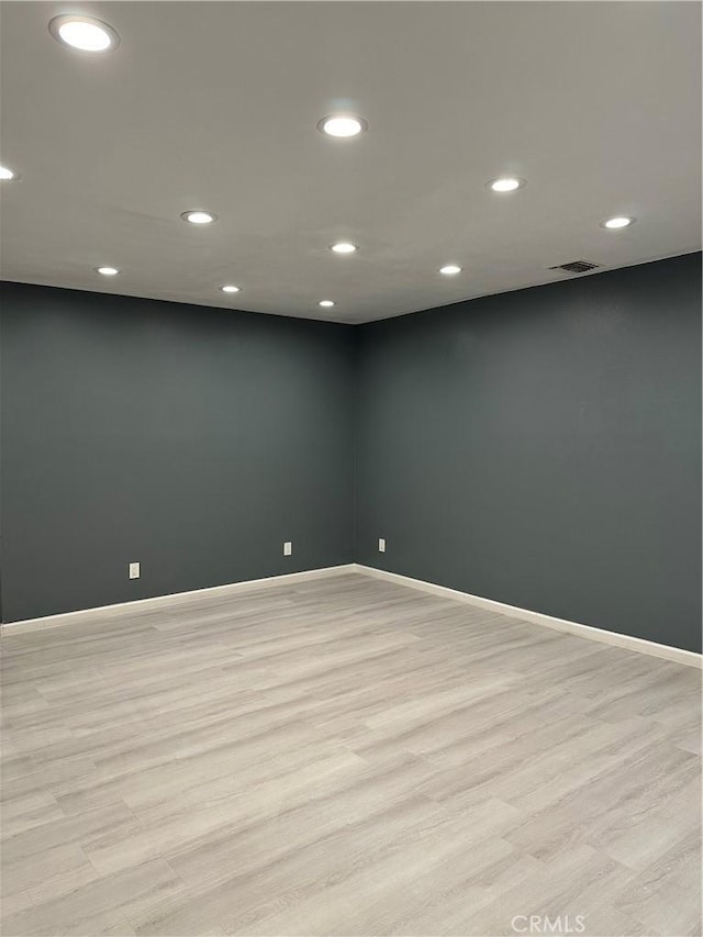 unfurnished room featuring light wood-type flooring